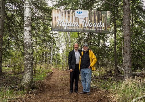 Al Hodnik, ALLETE chairman, president and CEO, and Jack Rajala in the woods near Taconite Harbor. The site on the North Shore of Lake Superior is the first to be highlighted in Minnesota Power’s Rajala Woods initiative.